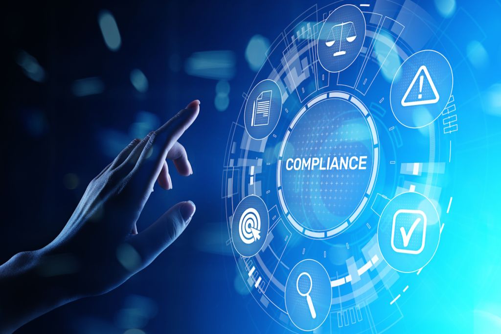 Hand reaching toward a digital compliance interface with icons for law, risk, search, and verification.